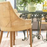 Fauteuil de table pieds en teck dossier en rotin